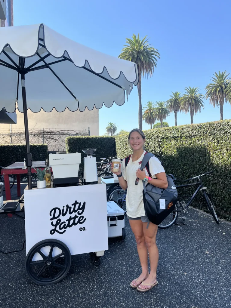 Student drink an iced coffee at The Hive Ellendale - USC off- campus housing